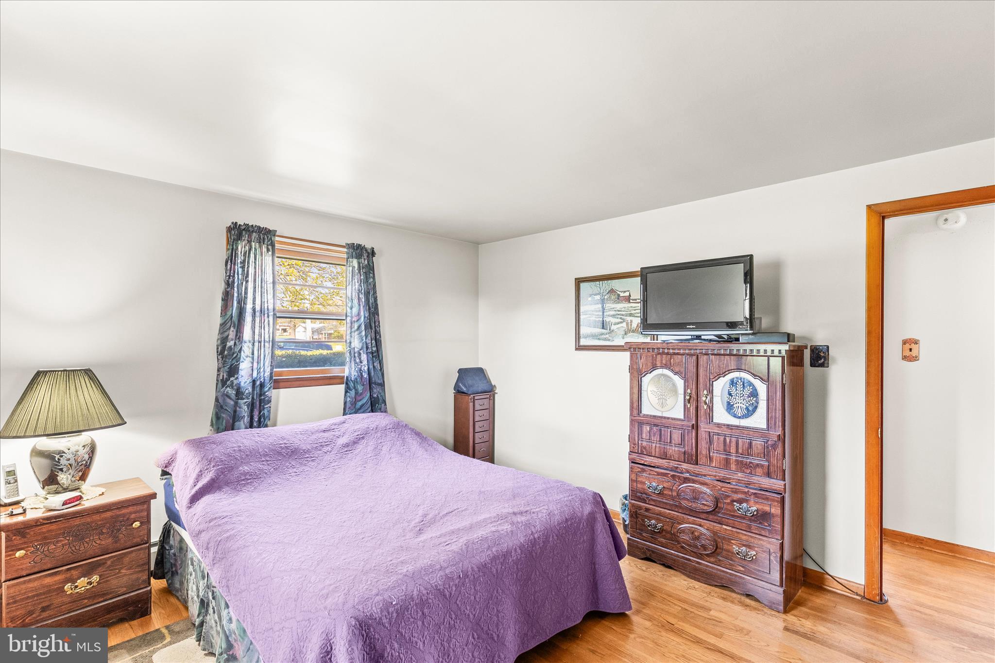 3530 East Prospect Road York, PA 17402 - Photo 21 of 37 a bedroom with a bed and a flat tv screen on dresser