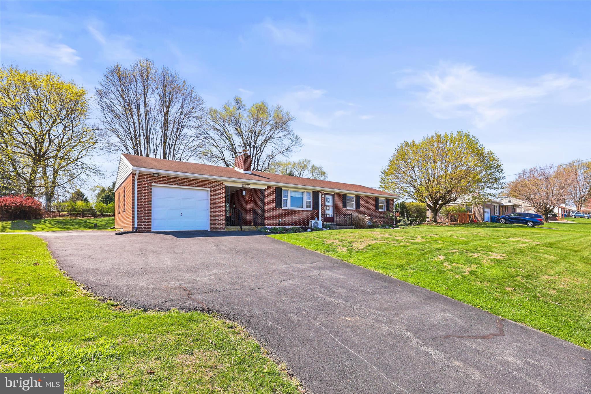3530 East Prospect Road York, PA 17402 - Photo 3 of 37 a front view of a house with a garden and trees
