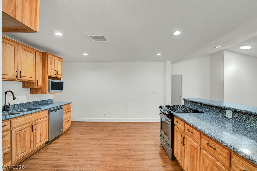 1810 Pinto Road Henderson, NV 89002 - Photo 22 of 53 A well-equipped kitchen features ample cabinetry, generous counter space, and integrated appliances.