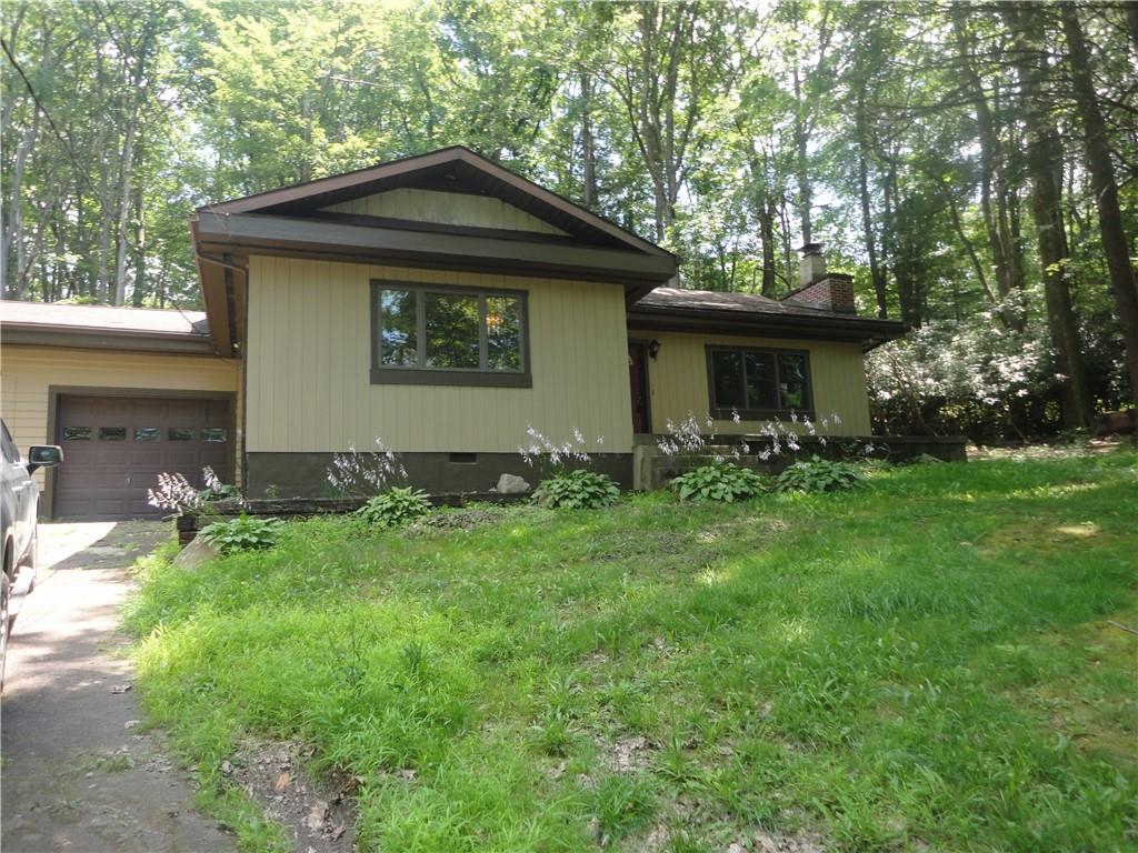 3202 Listonburg Road Confluence, PA 15424 - Photo 1 of 26 a front view of a house with garden