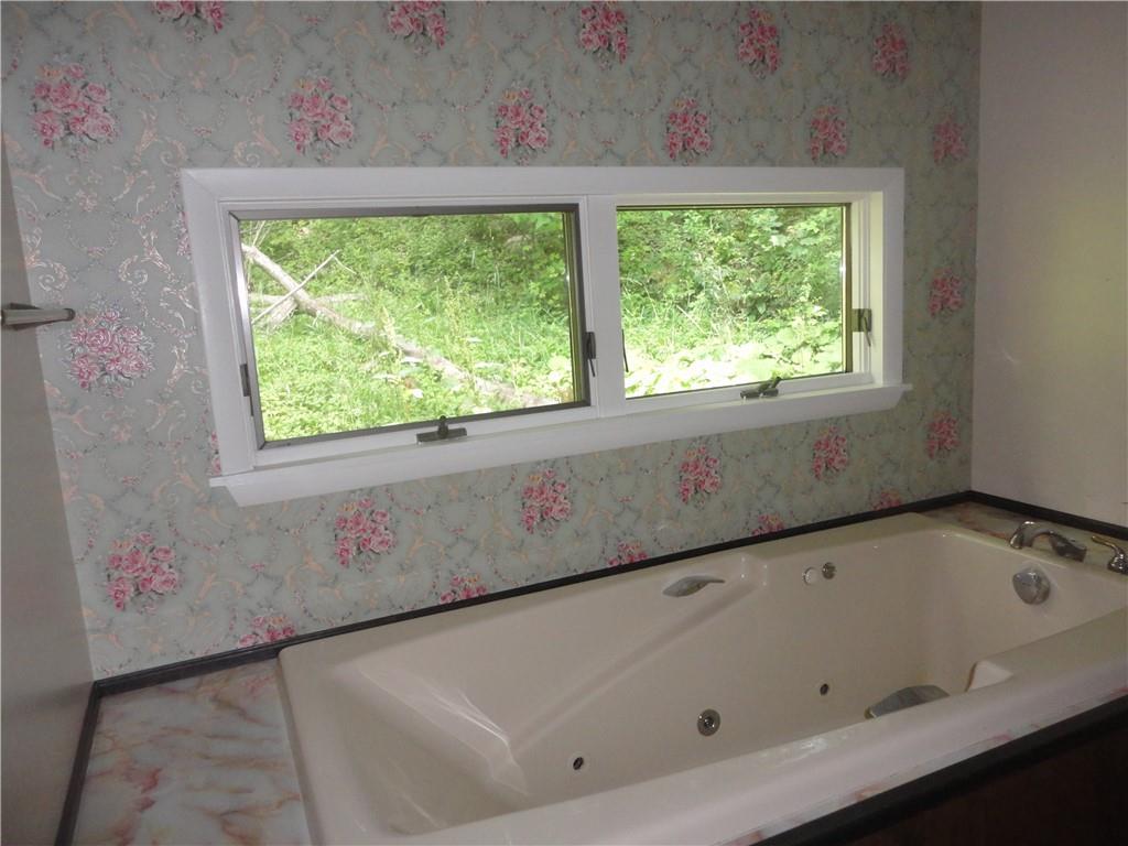 3202 Listonburg Road Confluence, PA 15424 - Photo 17 of 26 a bathroom with a bathtub and window
