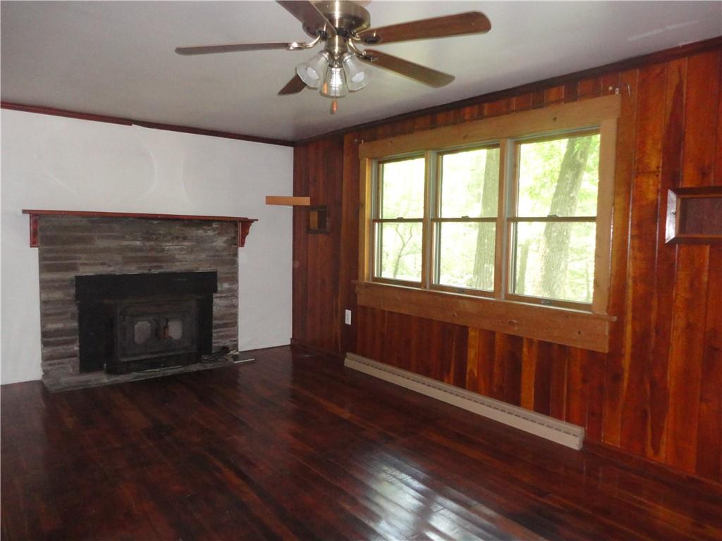 3202 Listonburg Road Confluence, PA 15424 - Photo 6 of 26 a view of an empty room with wooden floor and a window