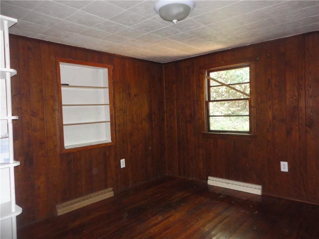 3202 Listonburg Road Confluence, PA 15424 - Photo 7 of 26 an empty room with wooden floor and windows