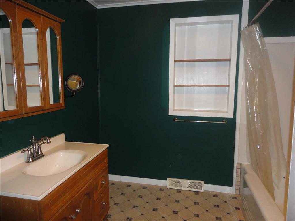 3202 Listonburg Road Confluence, PA 15424 - Photo 9 of 26 a bathroom with a sink and a mirror