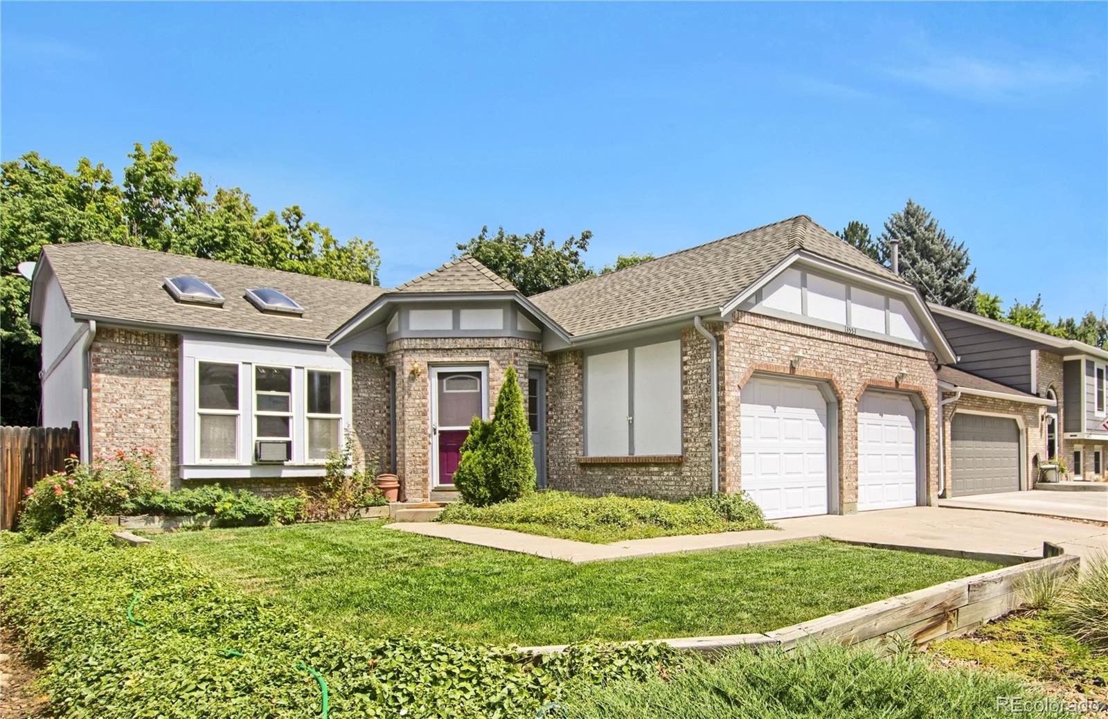front view of a house with a yard