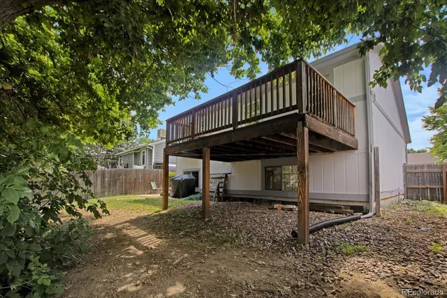 a view of a backyard with sitting area