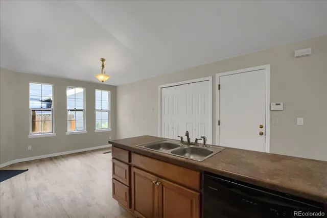 a kitchen with a sink and a window