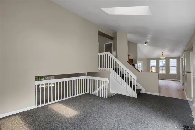 a view of an empty room with stairs