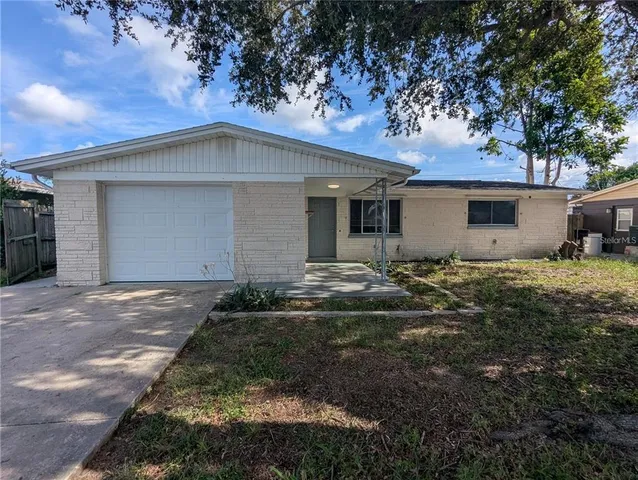 a backyard of a house with garage