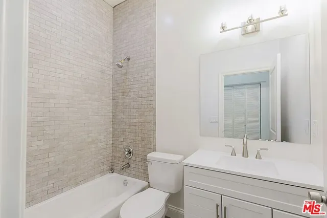 a bathroom with a bathtub and a toilet