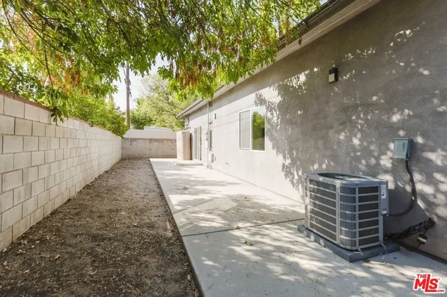 a view of a backyard with a large tree