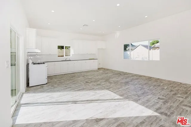 a view of kitchen with wooden floor