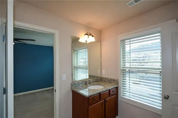a kitchen with a stove and a window