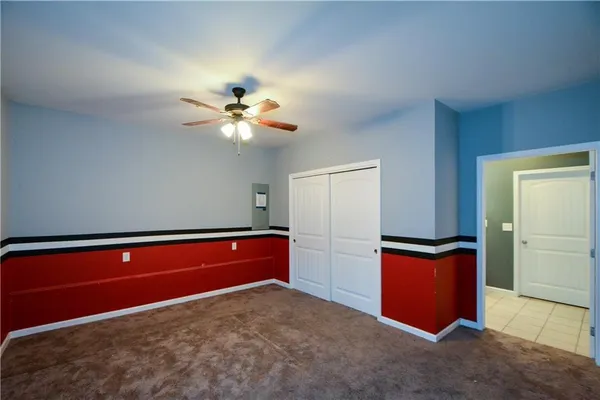 a room with closet and chandelier