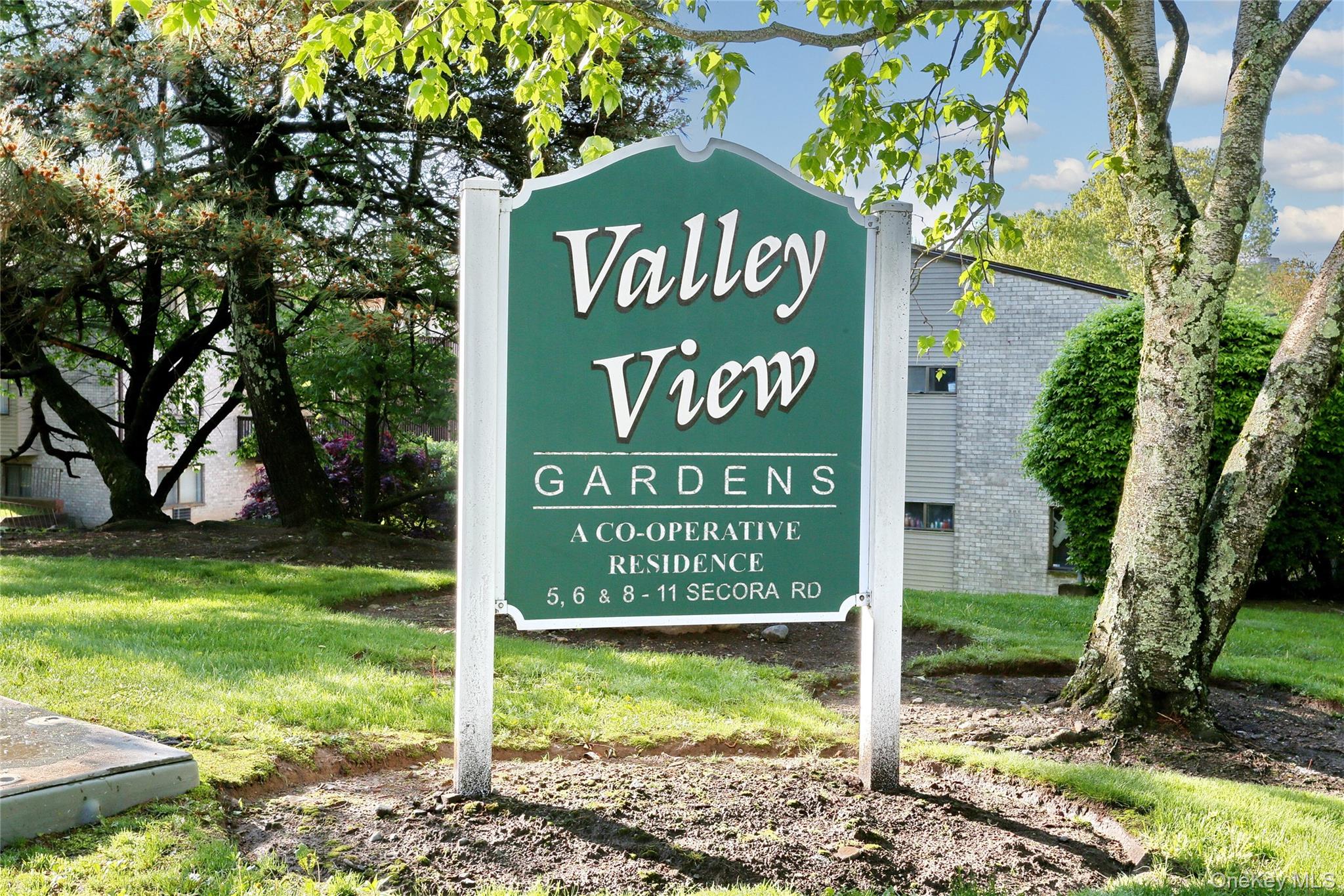 5 Secora Road, Unit F7 Spring Valley, NY 10977 - Photo 2 of 21 a sign on the side of the road