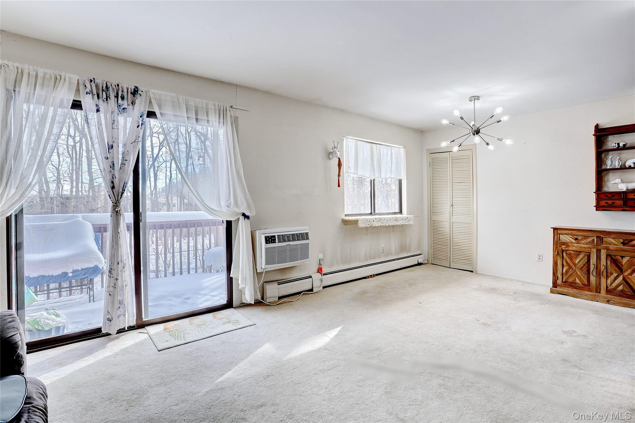 5 Secora Road, Unit F7 Spring Valley, NY 10977 - Photo 7 of 21 a view of a livingroom with a furniture and chandelier fan