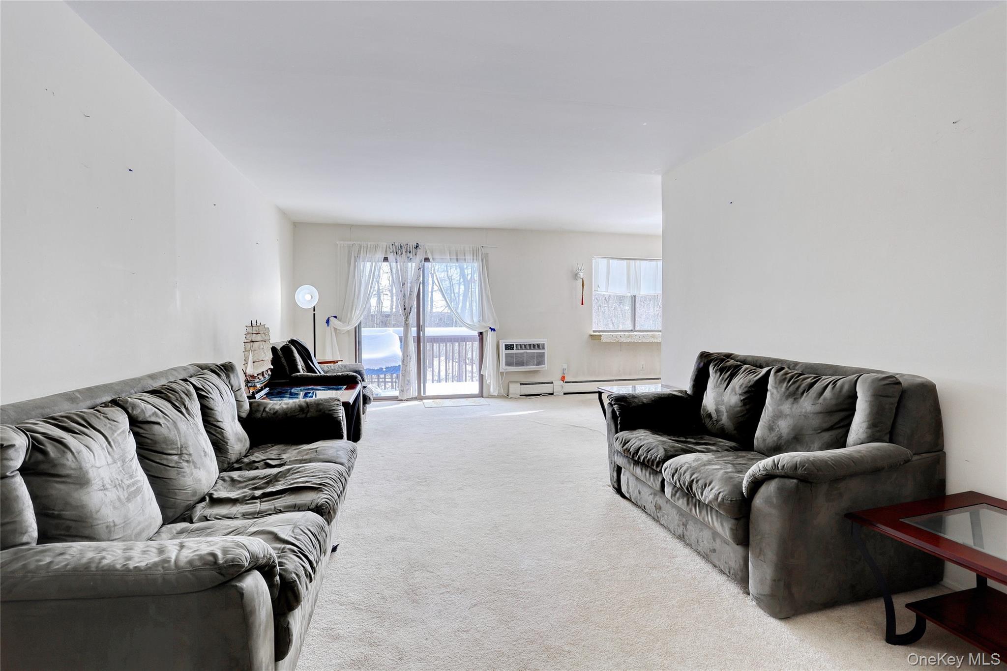 5 Secora Road, Unit F7 Spring Valley, NY 10977 - Photo 10 of 21 a living room with furniture and a couch