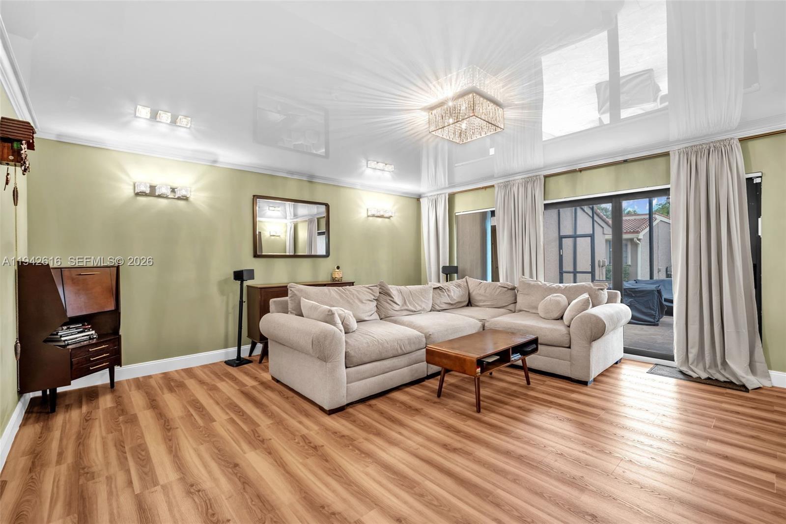 107 Heatherbrook Way, Unit 145 Hollywood, FL 33021 - Photo 15 of 57 a living room with furniture and wooden floor