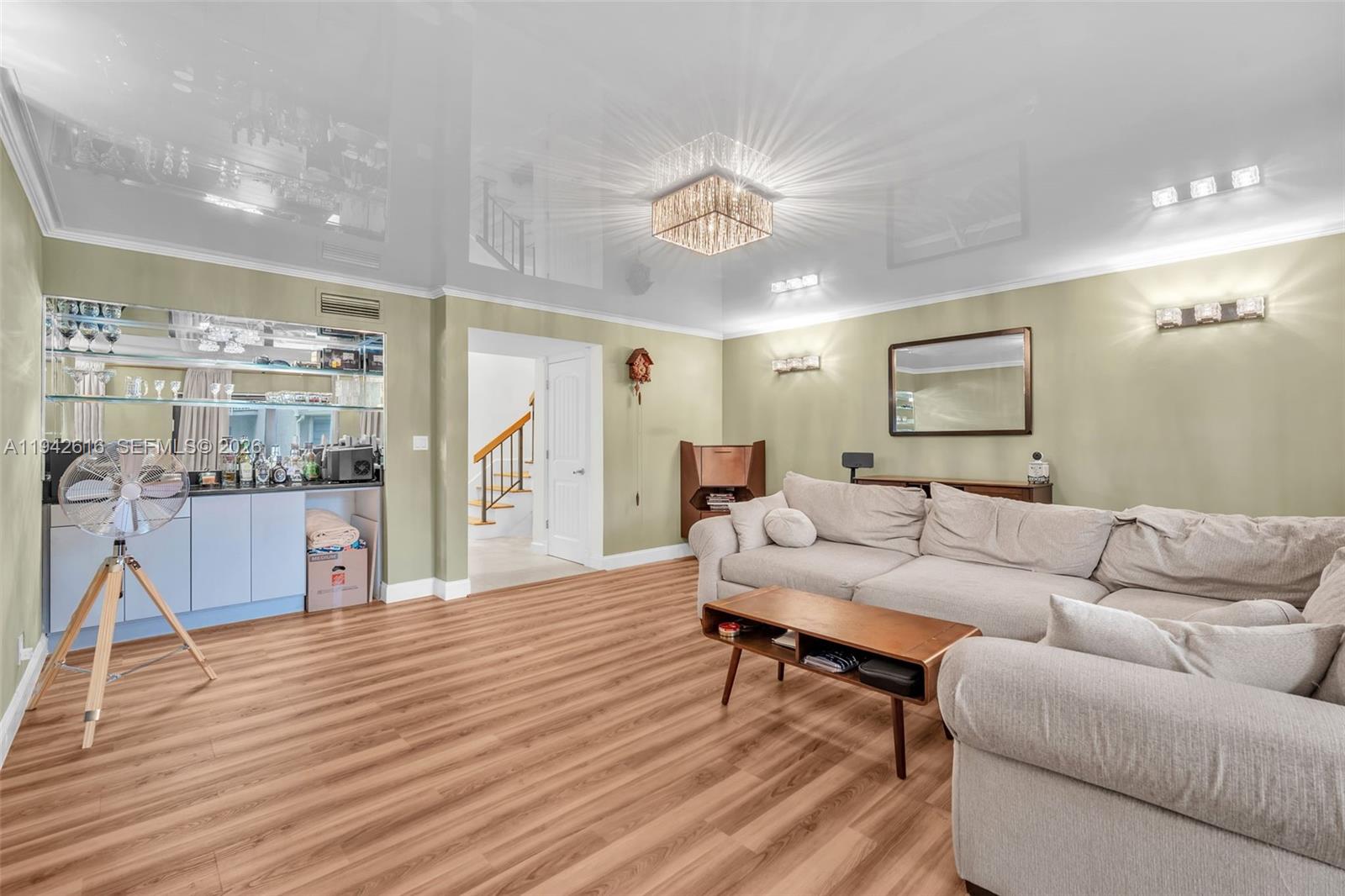 107 Heatherbrook Way, Unit 145 Hollywood, FL 33021 - Photo 16 of 57 a living room with furniture and a wooden floor
