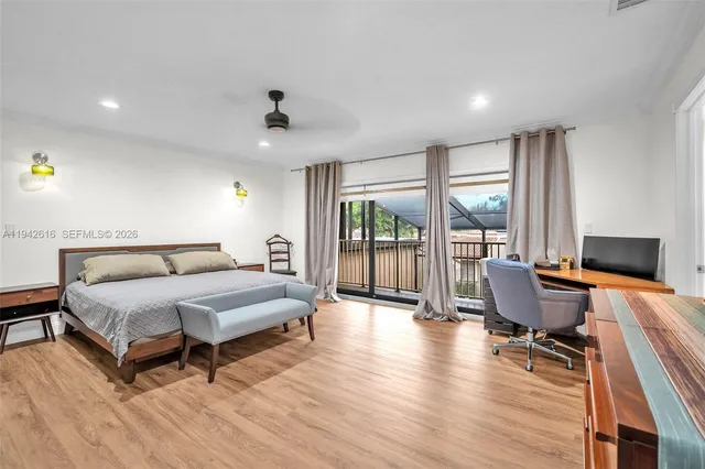 a bed room with a bed and a large window