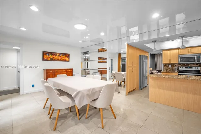 a dinning room with a table and chairs