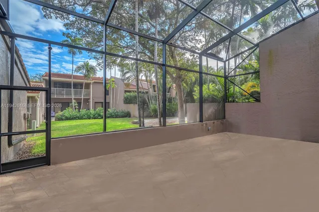 a view of a backyard with a garden and plants
