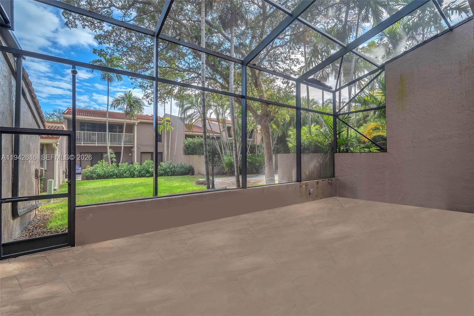 107 Heatherbrook Way, Unit 145 Hollywood, FL 33021 - Photo 33 of 57 a view of a house with backyard and porch