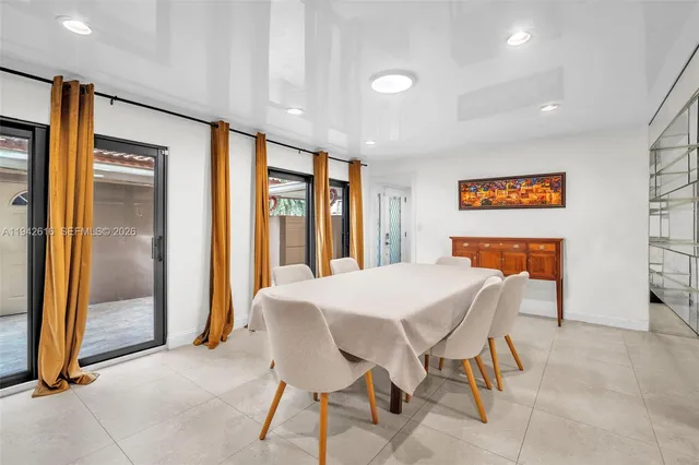 a kitchen with stainless steel appliances granite countertop a stove refrigerator and microwave