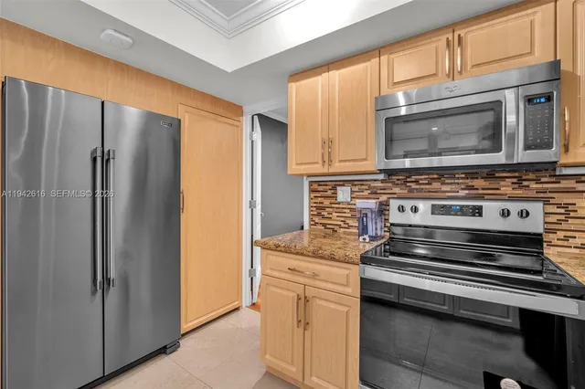 a bedroom with a bed and a desk in it