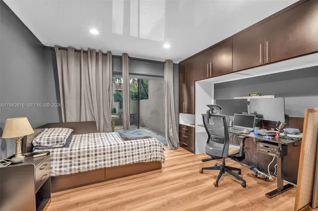 a view of an entryway with wooden floor