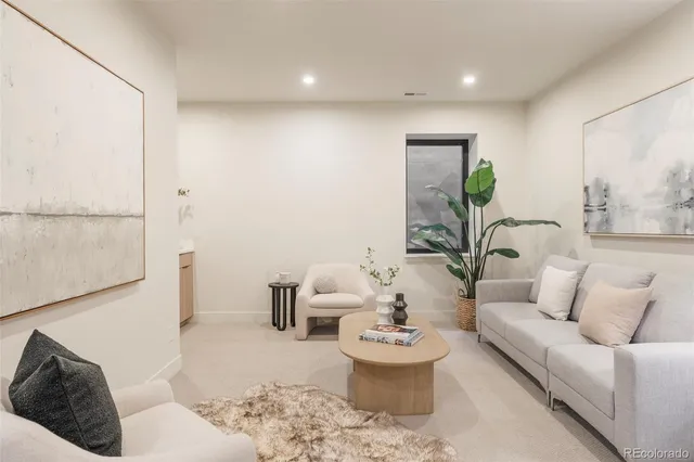 a living room with furniture and a rug