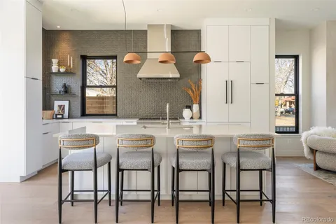 a kitchen with a table and chairs in it