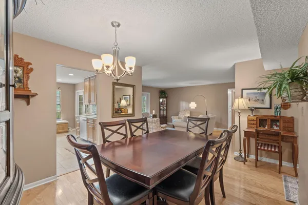 a view of a dining room with furniture and wooden floor