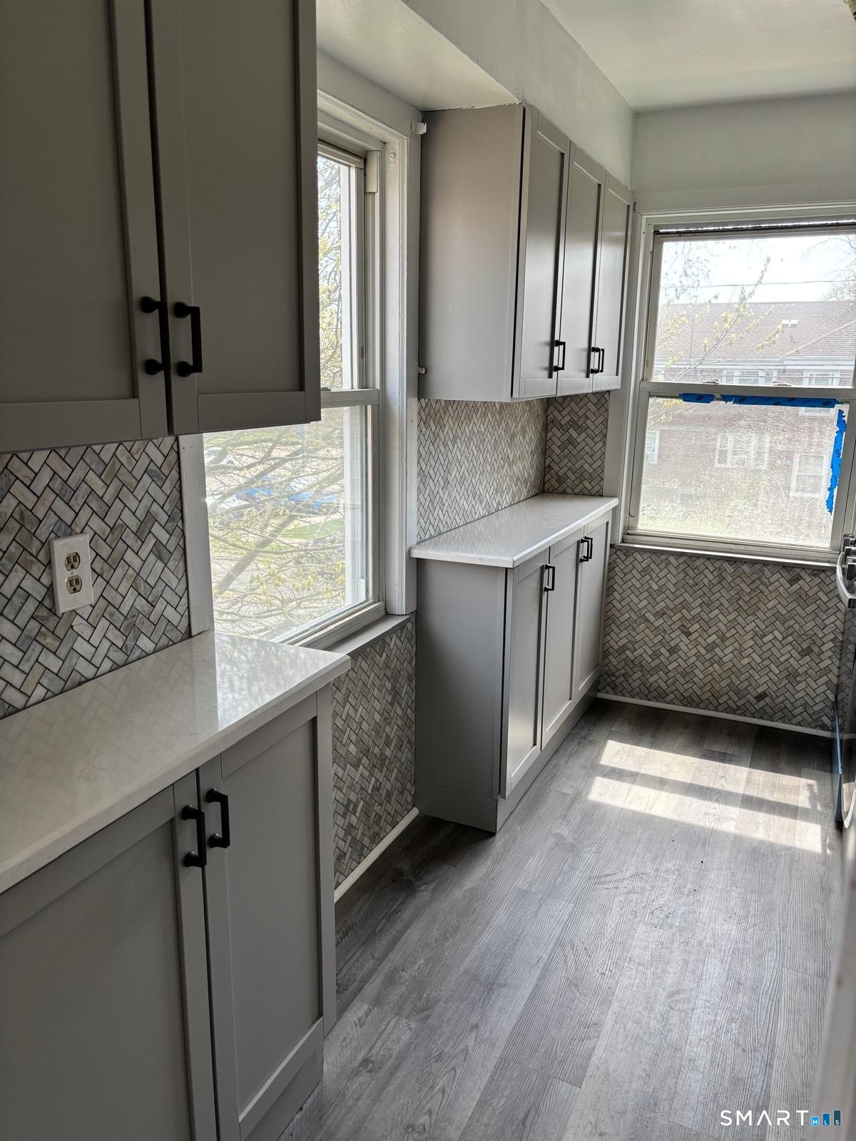 744 Canaan Road, Unit 23 Bridgeport, CT 06610 - Photo 12 of 12 a kitchen with granite countertop a sink and a stove