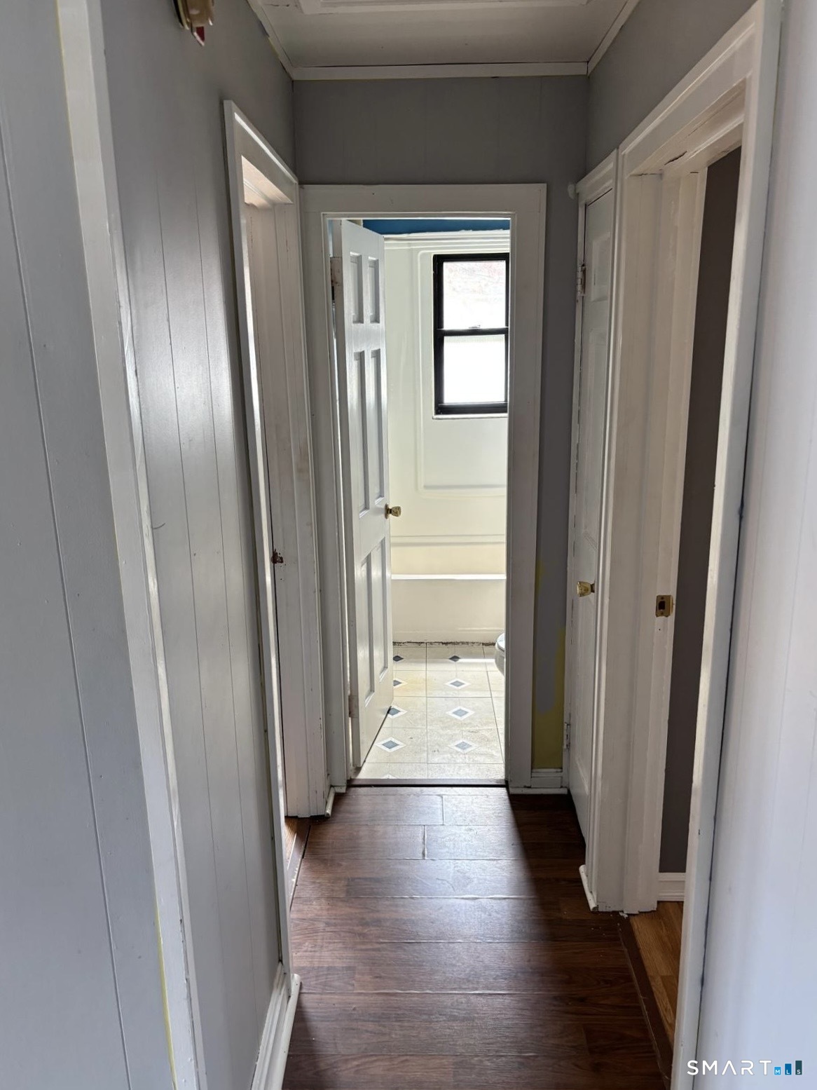 744 Canaan Road, Unit 23 Bridgeport, CT 06610 - Photo 5 of 12 a view of a hallway with wooden floor