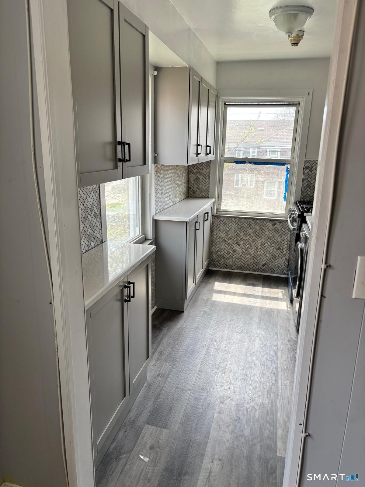 744 Canaan Road, Unit 23 Bridgeport, CT 06610 - Photo 7 of 12 a kitchen with refrigerator and window