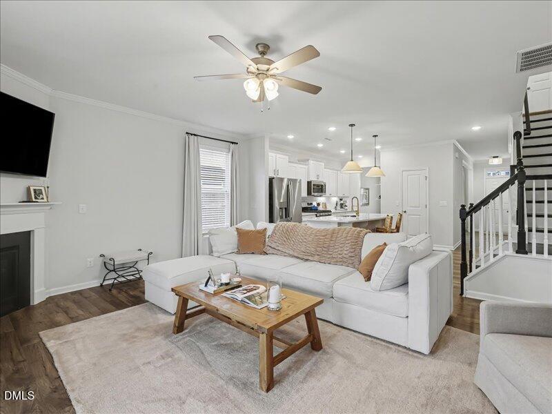 724 Summer Music Lane Raleigh, NC 27603 - Photo 21 of 70 a living room with furniture and a flat screen tv