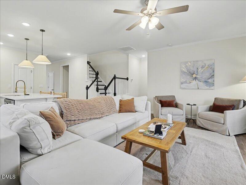 724 Summer Music Lane Raleigh, NC 27603 - Photo 25 of 70 a living room with furniture and a chandelier