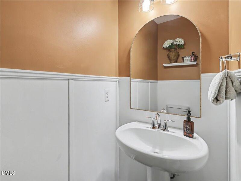 724 Summer Music Lane Raleigh, NC 27603 - Photo 4 of 70 a bathroom with a sink and mirror
