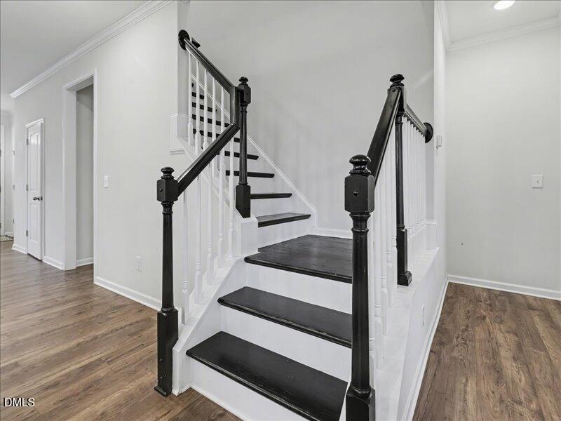 724 Summer Music Lane Raleigh, NC 27603 - Photo 40 of 70 a view of entryway with wooden floor and stairs