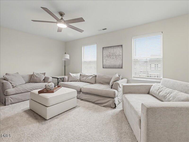 724 Summer Music Lane Raleigh, NC 27603 - Photo 41 of 70 a living room with furniture and a large window