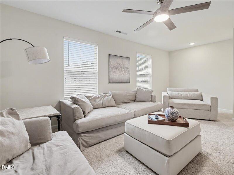 724 Summer Music Lane Raleigh, NC 27603 - Photo 42 of 70 a living room with furniture and a window