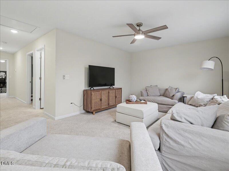 724 Summer Music Lane Raleigh, NC 27603 - Photo 43 of 70 a living room with furniture and a flat screen tv