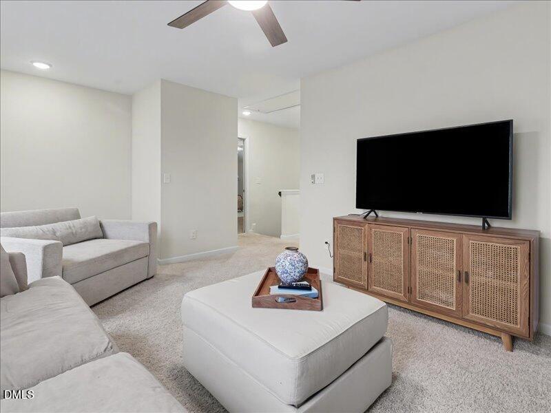 724 Summer Music Lane Raleigh, NC 27603 - Photo 44 of 70 a living room with furniture and a flat screen tv