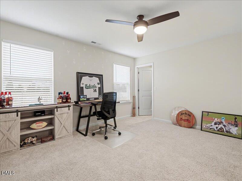724 Summer Music Lane Raleigh, NC 27603 - Photo 48 of 70 a view of a workspace with furniture