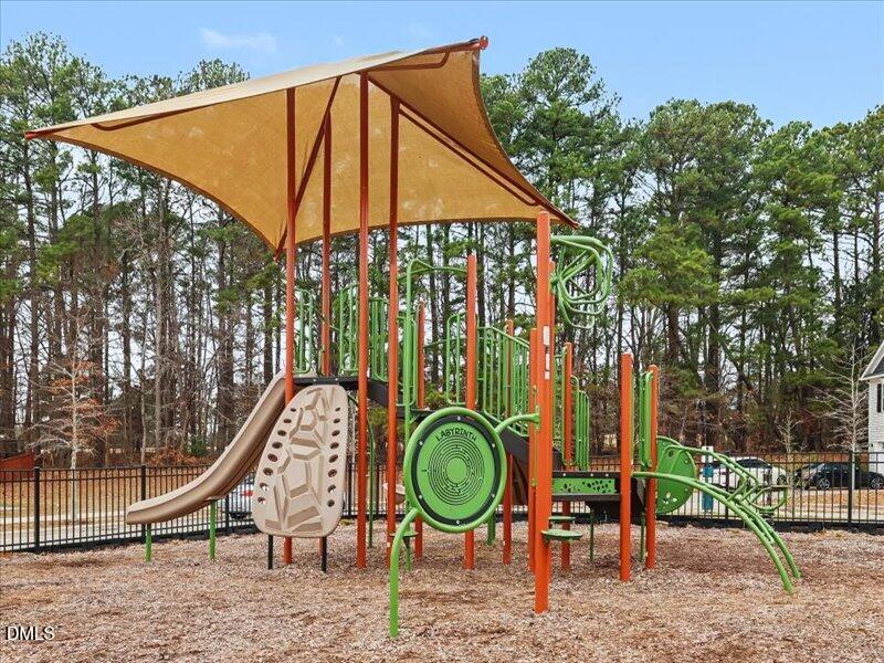 724 Summer Music Lane Raleigh, NC 27603 - Photo 57 of 70 a backyard of a house with entertaining space and staircase