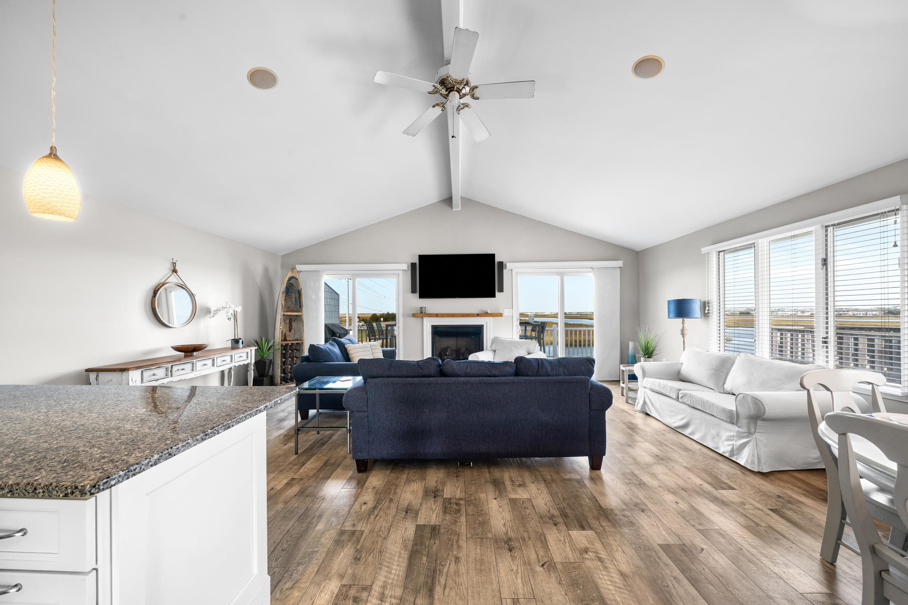 2934 Ocean Drive, Unit NORTH Avalon, NJ 08202 - Photo 14 of 33 a living room with fireplace furniture and a flat screen tv