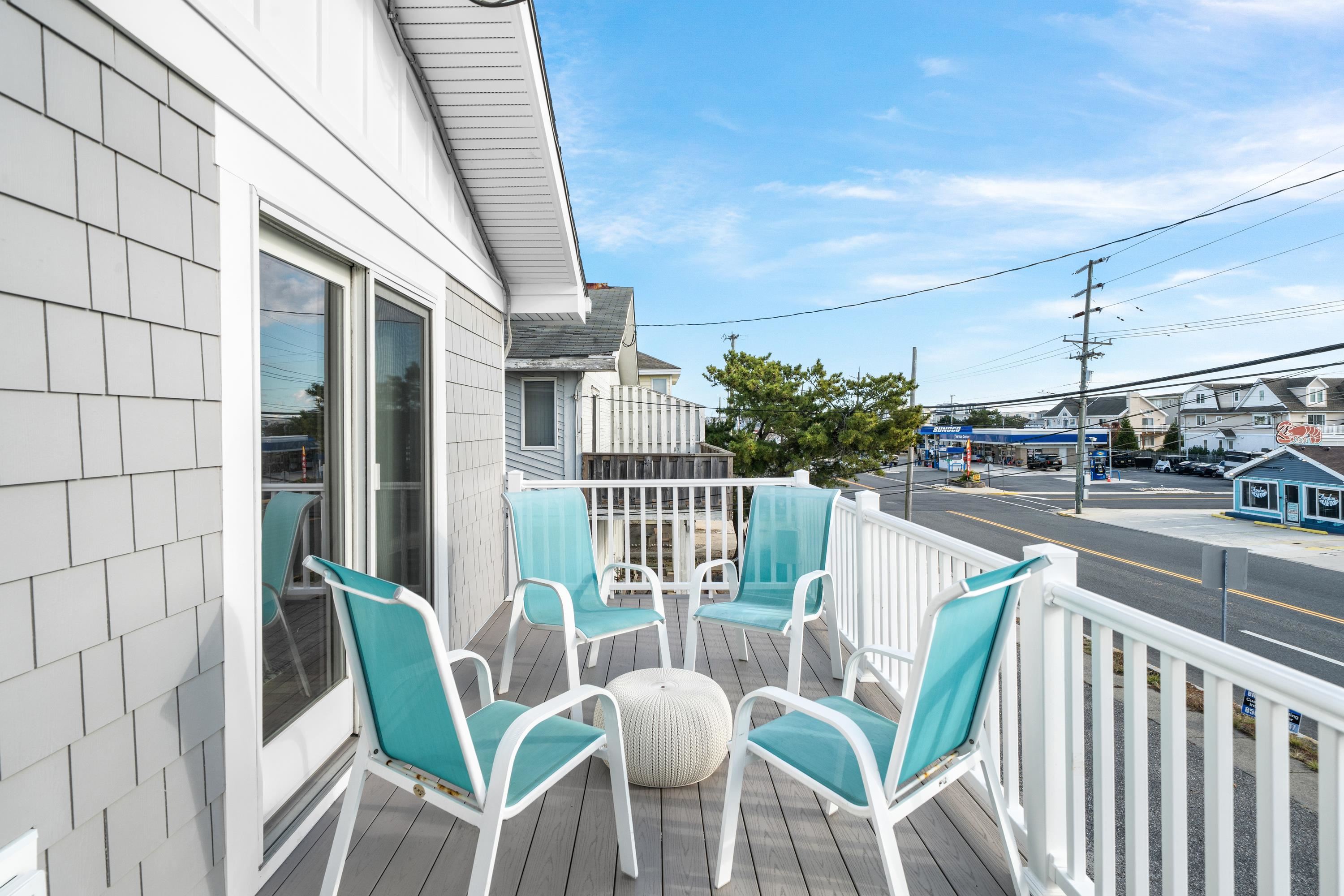 2934 Ocean Drive, Unit NORTH Avalon, NJ 08202 - Photo 16 of 33 a view of a chair and tables in the balcony
