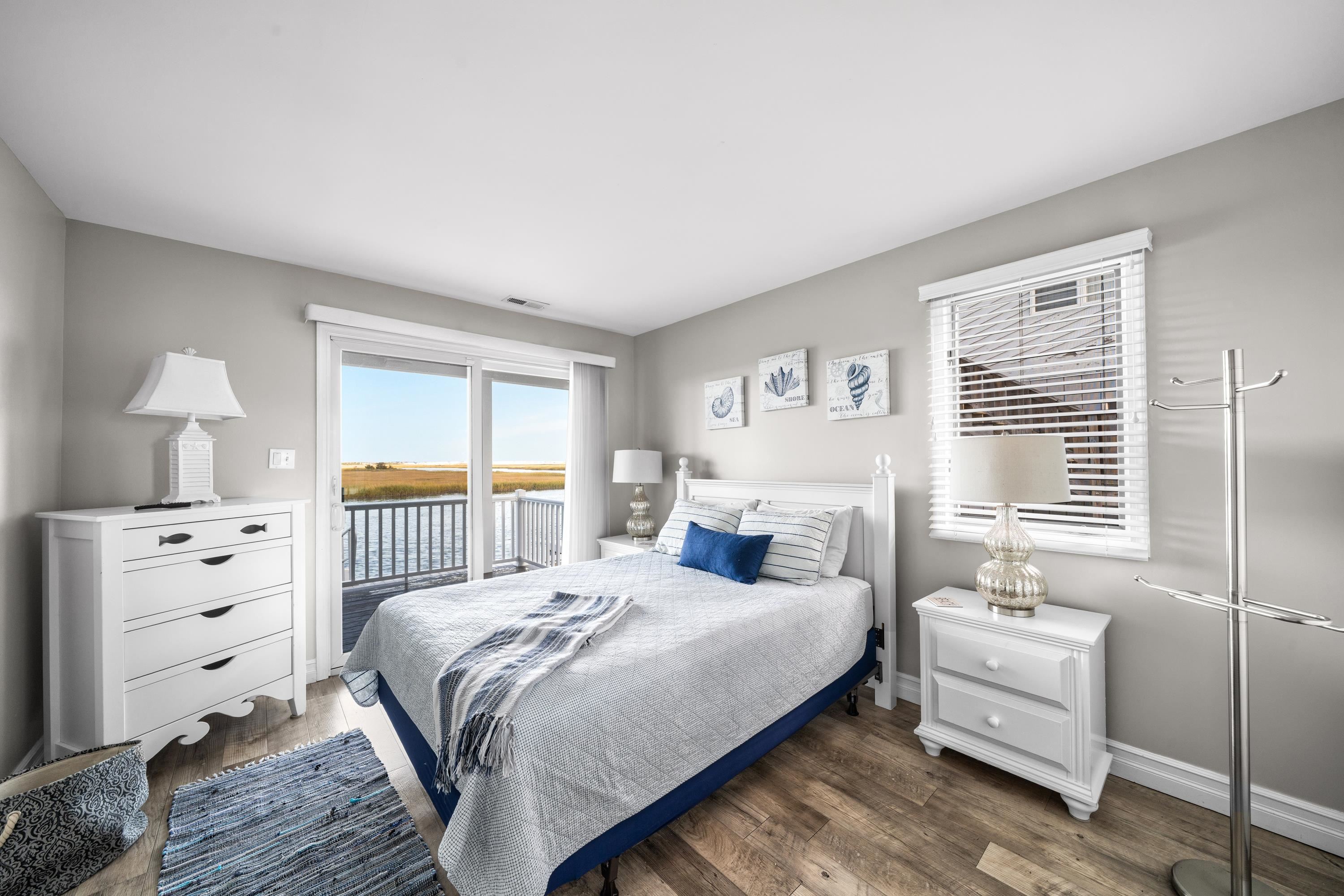 2934 Ocean Drive, Unit NORTH Avalon, NJ 08202 - Photo 17 of 33 a bedroom with a bed and a window