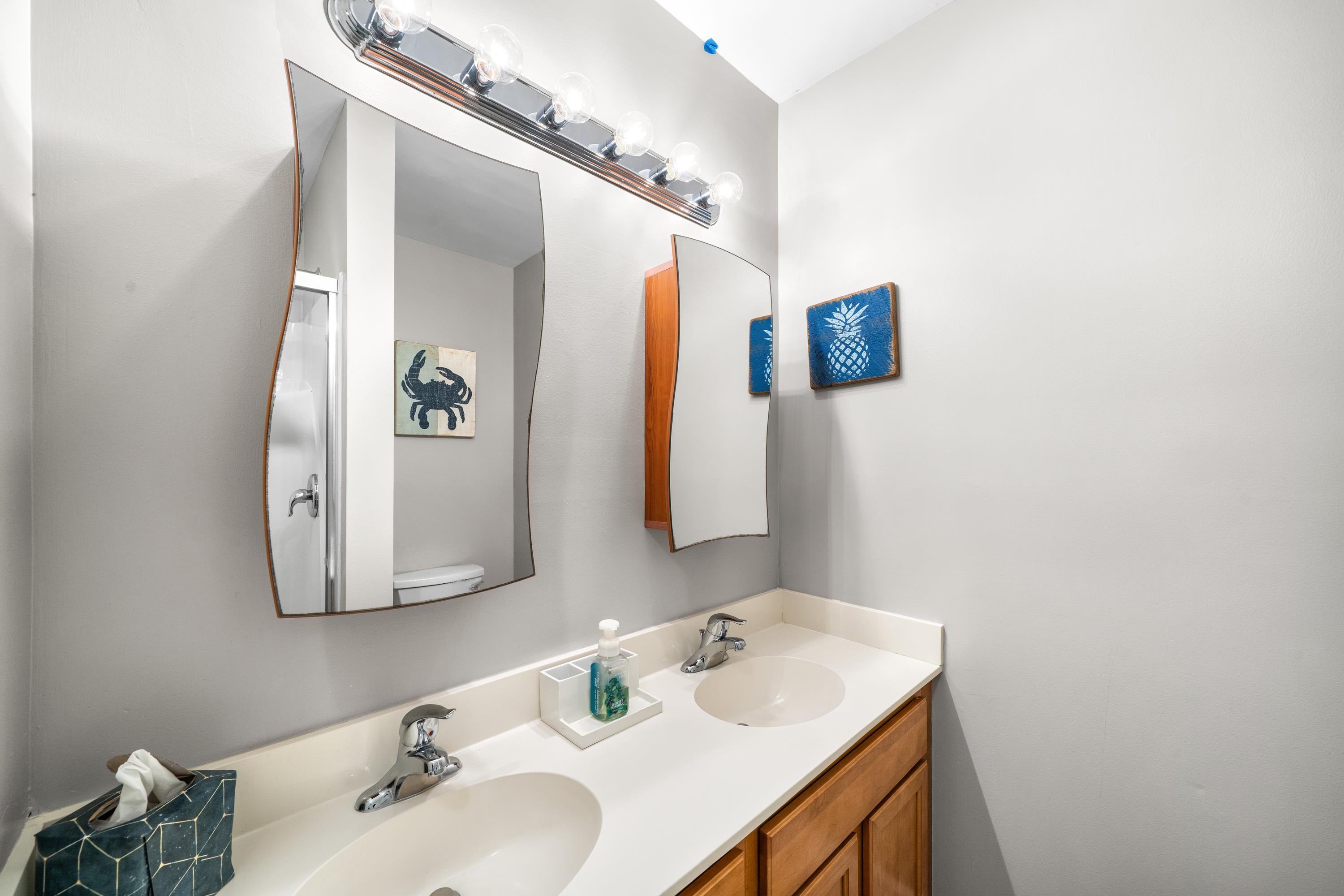 2934 Ocean Drive, Unit NORTH Avalon, NJ 08202 - Photo 26 of 33 a bathroom with a sink and a mirror